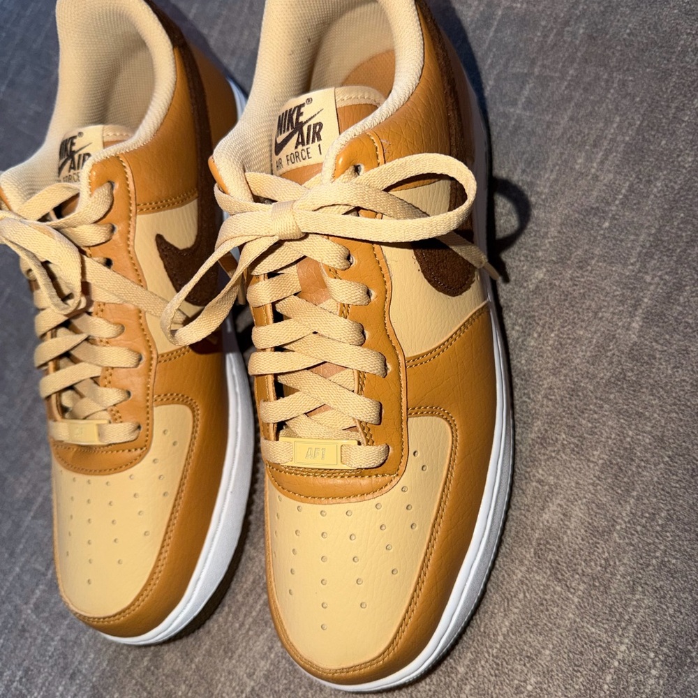 Nike Air Force ones. Tan and brown.